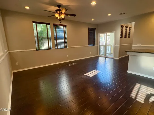 a view of kitchen with cabinets and wooden floor