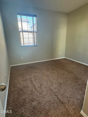 en empty room with windows