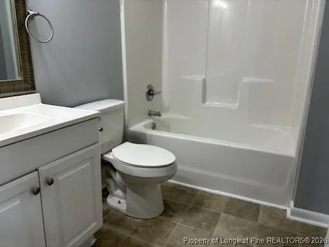 a bathroom with a toilet a sink and bathtub