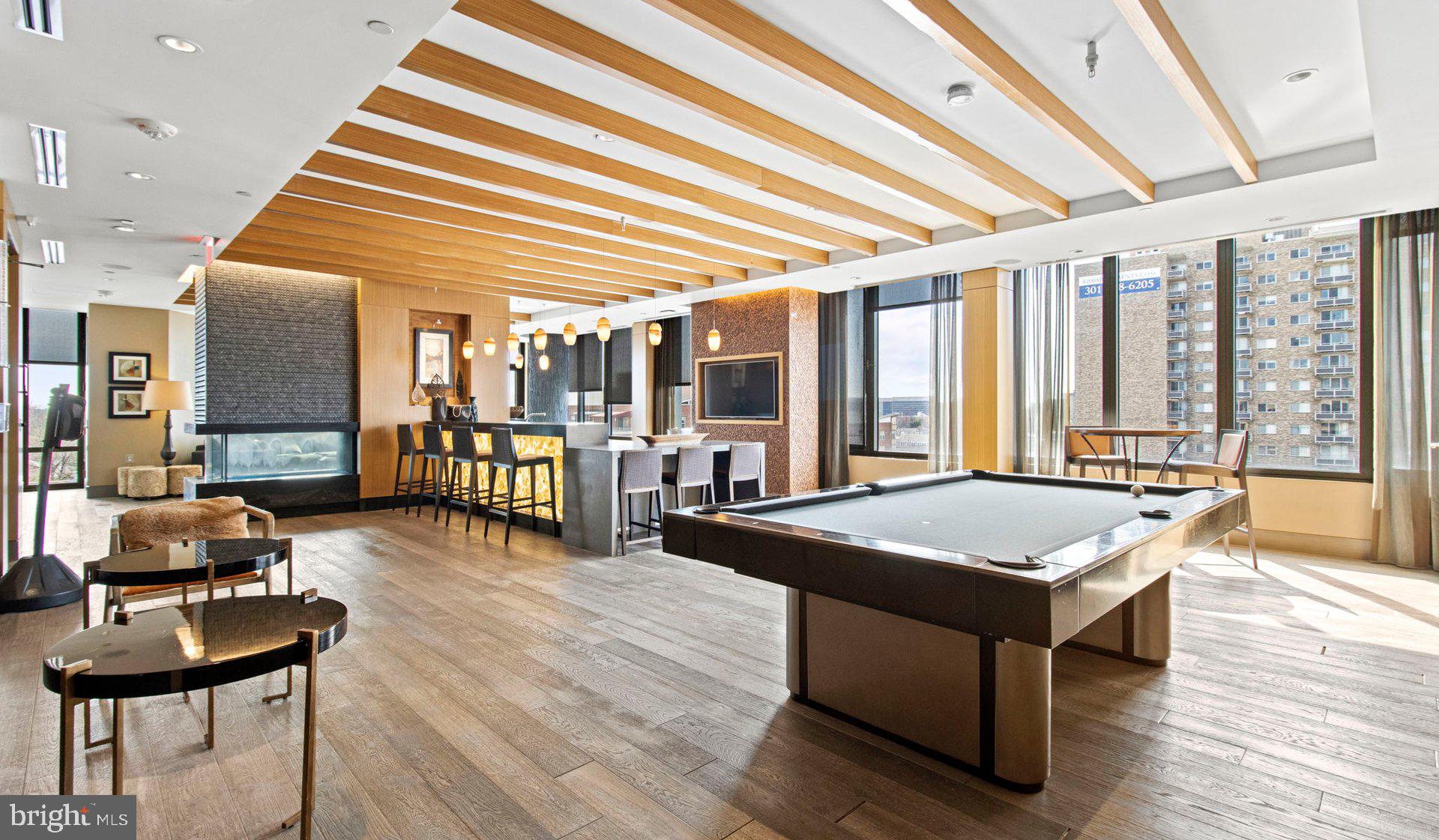 8300 Wisconsin Avenue, Unit 0B1313 Bethesda, MD 20814 - Photo 27 of 150 a room with pool table and glass windows