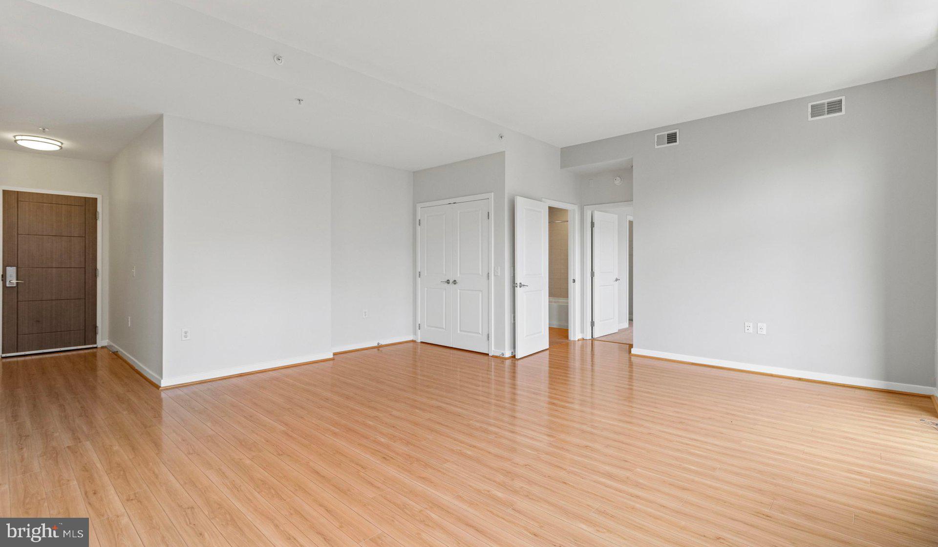 8300 Wisconsin Avenue, Unit 0B1313 Bethesda, MD 20814 - Photo 79 of 150 a view of an empty room with wooden floor