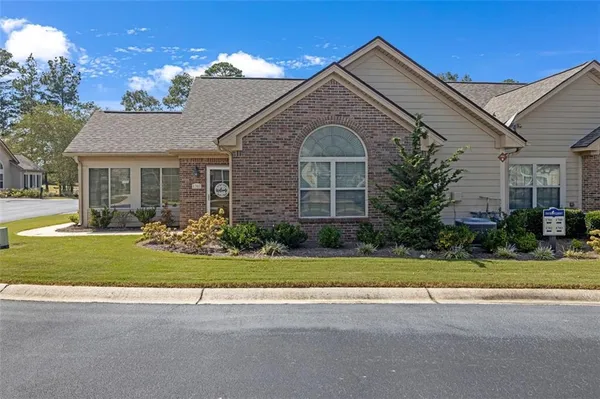 a front view of a house with a yard