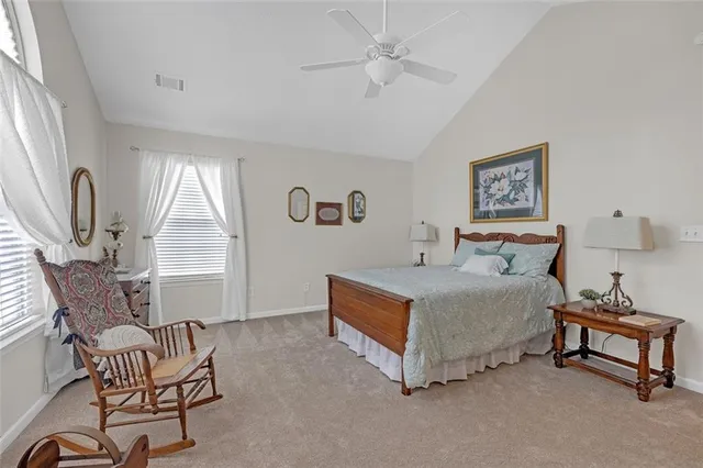 a bedroom with furniture and a window