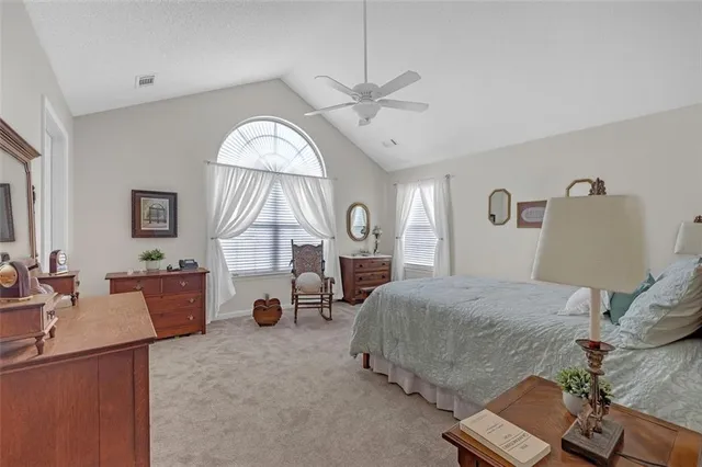 a bedroom with bed and window