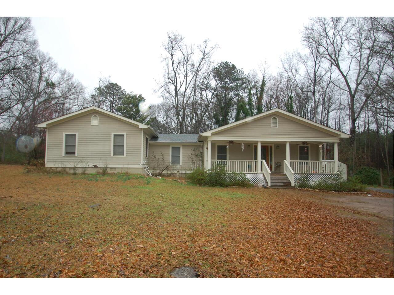931 Polk Road, Unit TRACT1&2 Moreland, GA 30259 - Photo 1 of 1 a front view of a house with a garden