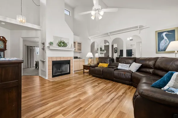 a living room with furniture and a fireplace