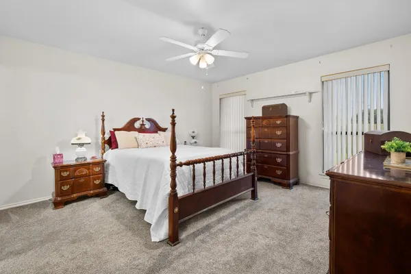 a bedroom with furniture and a window