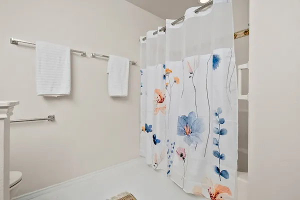 a bathroom with a shower curtain