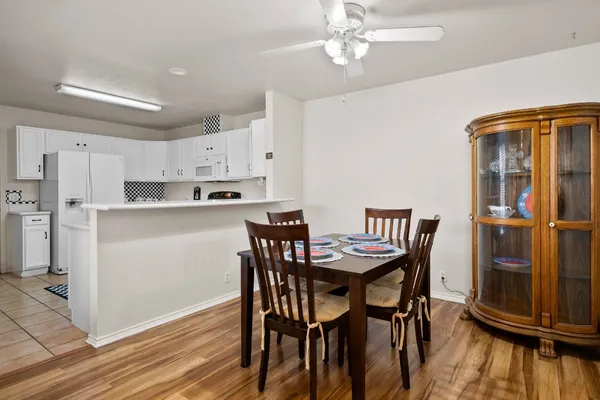 a view of a dining room with furniture and wooden floor