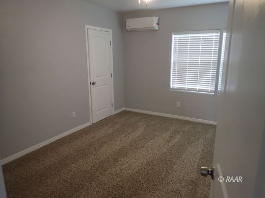 4423 Johnston Avenue Ridgecrest, CA 93555 - Photo 9 of 14 an empty room with a window