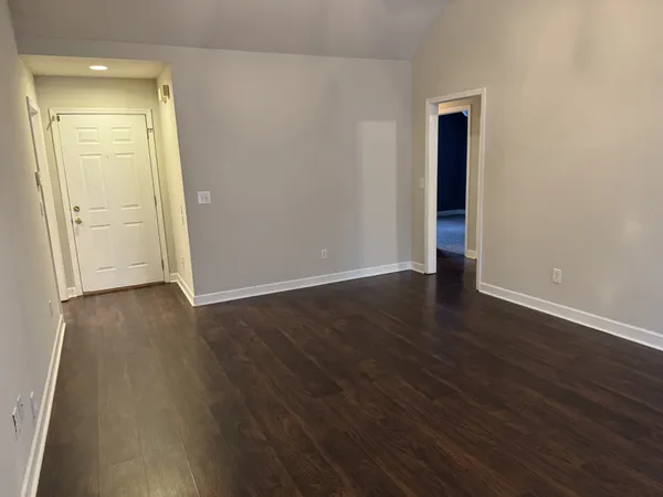 a kitchen with wooden cabinets and a sink