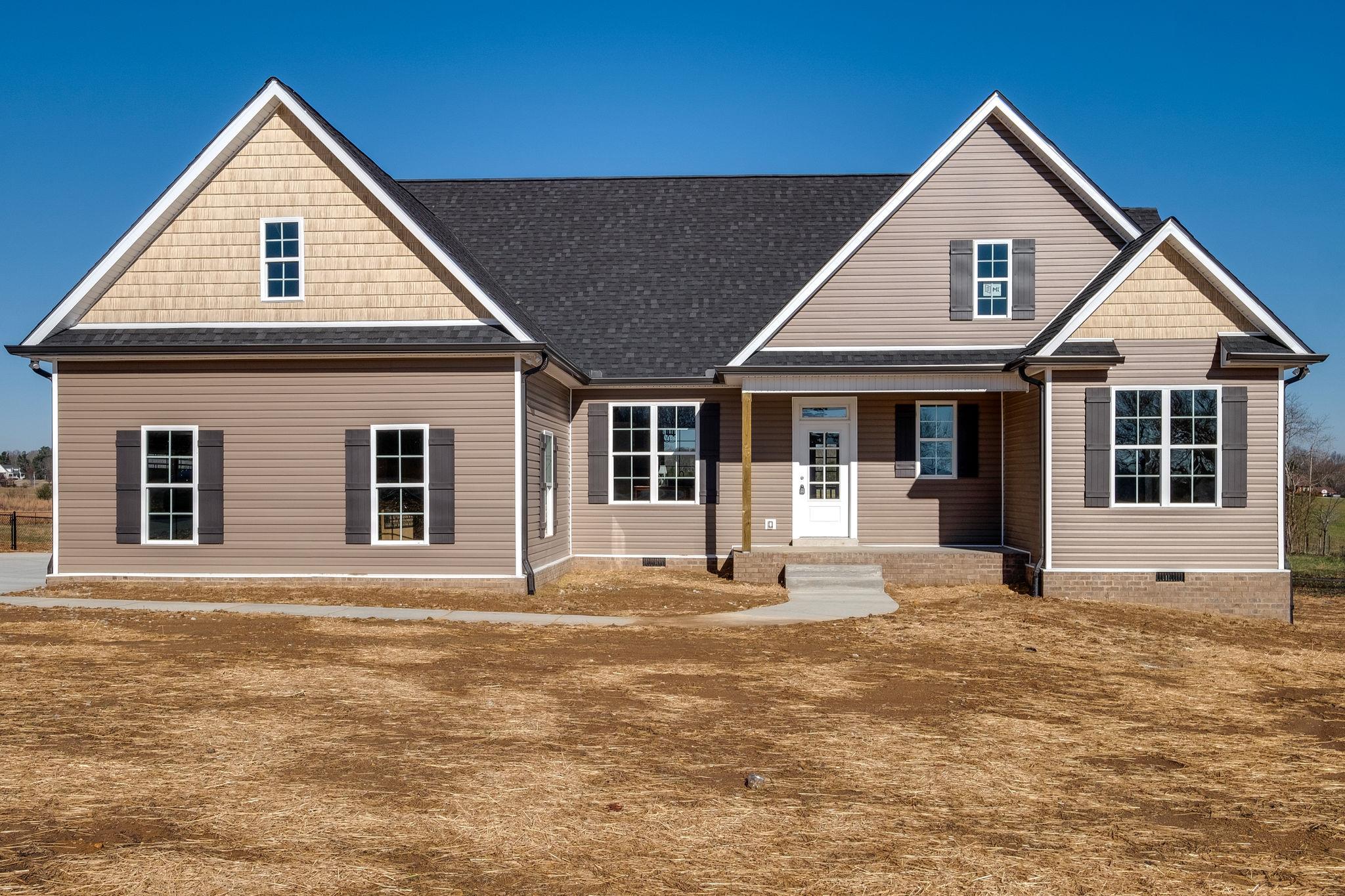 1809 Abiff Road Burns, TN 37029 - Photo 1 of 28 a front view of a house with a yard