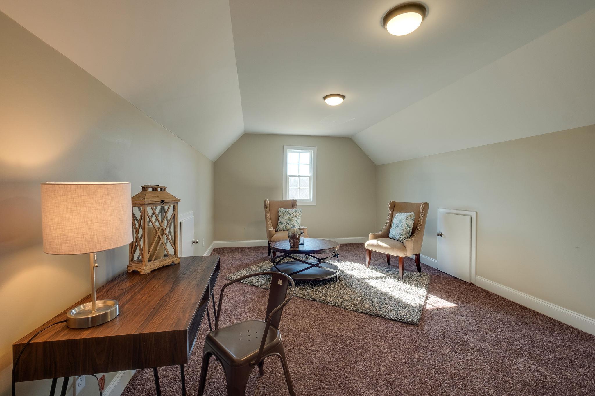 1809 Abiff Road Burns, TN 37029 - Photo 15 of 28 a living room with furniture and a lamp