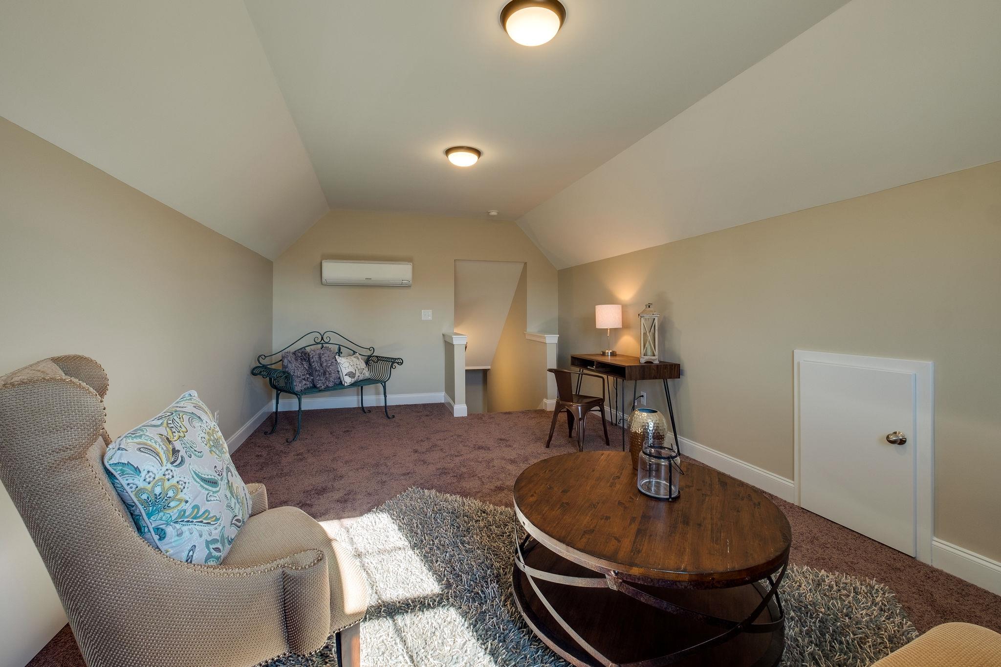 1809 Abiff Road Burns, TN 37029 - Photo 16 of 28 a living room with furniture and a lamp