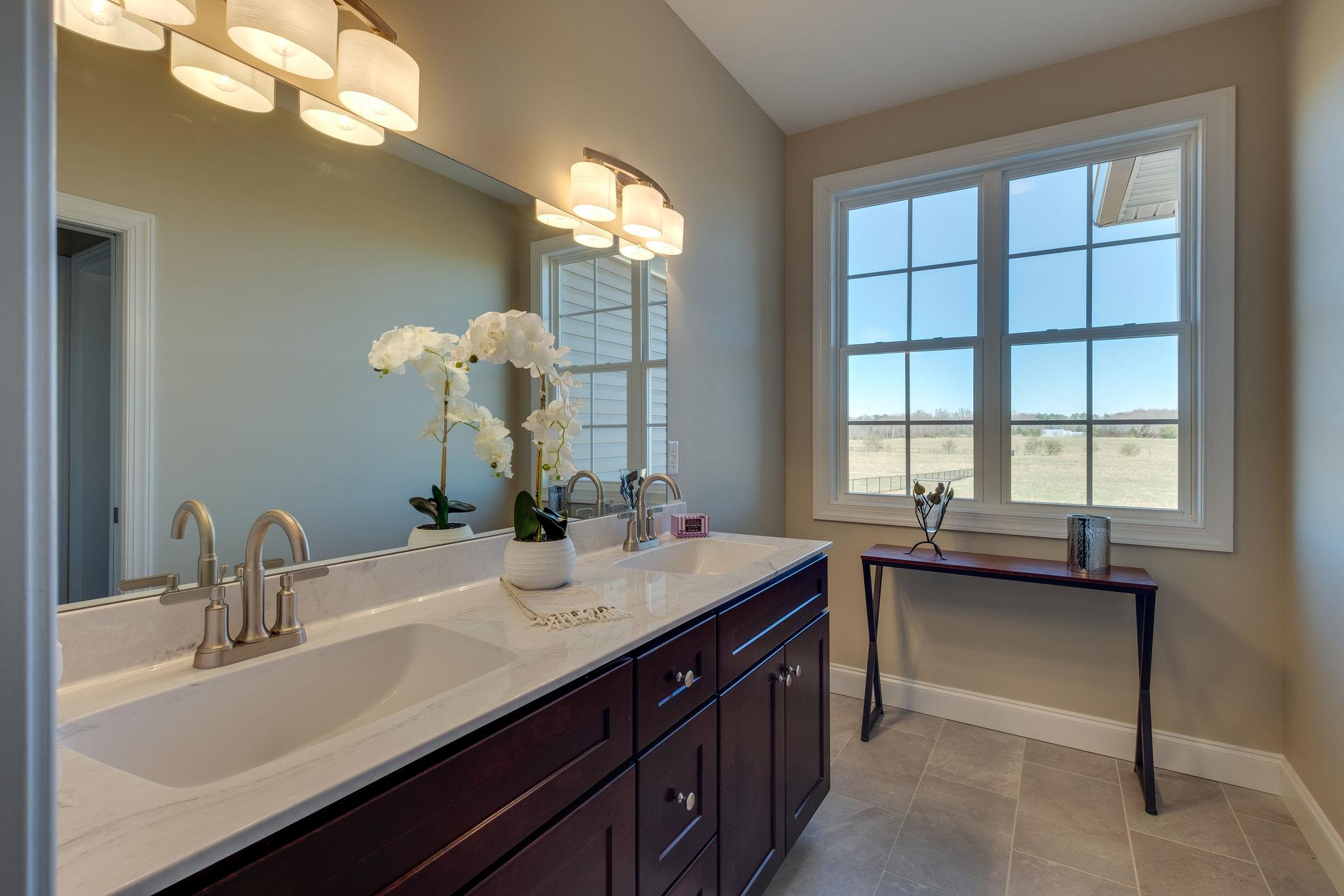 1809 Abiff Road Burns, TN 37029 - Photo 19 of 28 a bathroom with a sink double vanity and a mirror