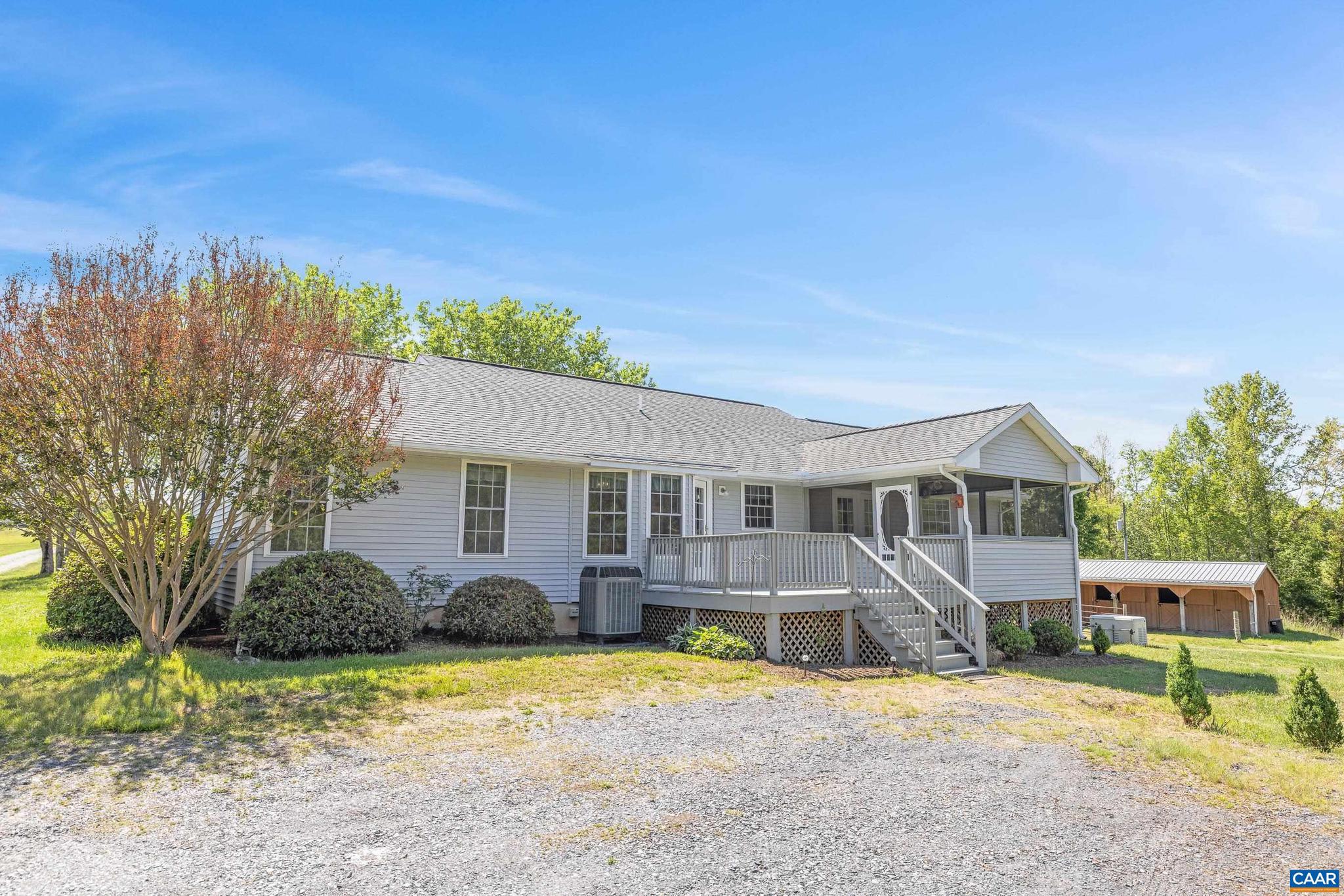 1075 Social Hall Road New Canton, VA 23123 - Photo 25 of 64 front view of a house with a yard