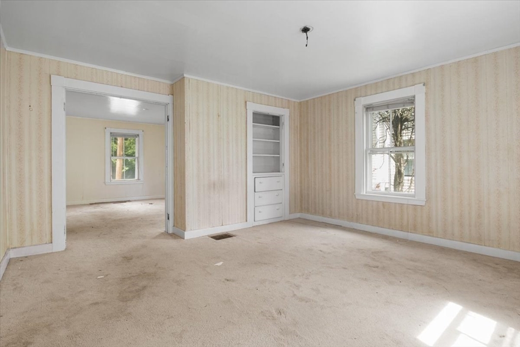 50 Clark Street Dedham, MA 02026 - Photo 15 of 38 a view of an empty room with closet and a window