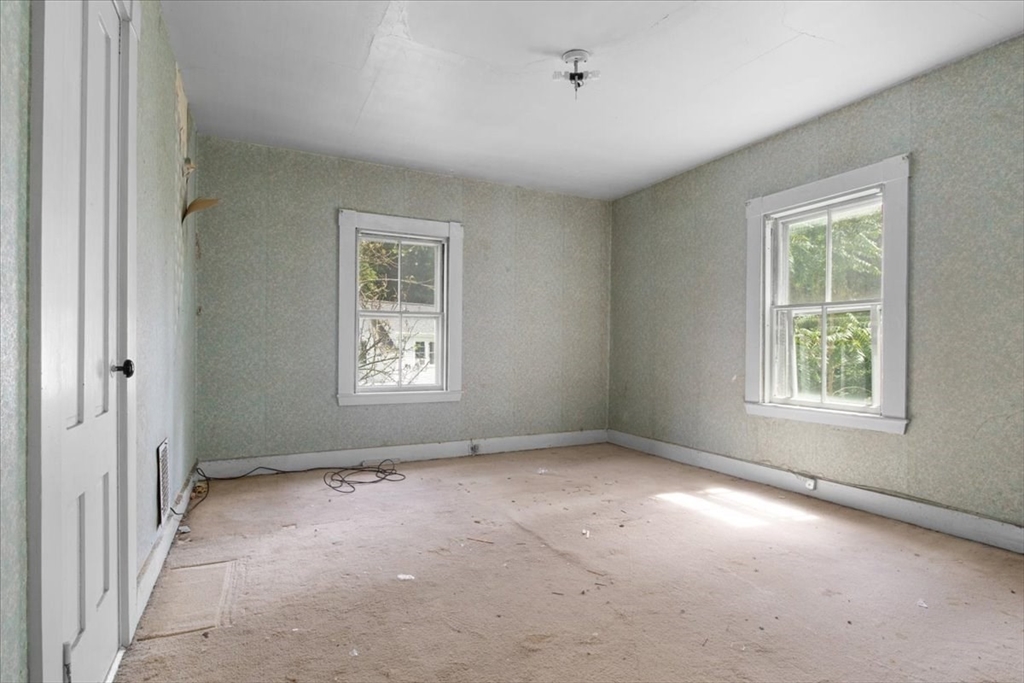 50 Clark Street Dedham, MA 02026 - Photo 23 of 38 a view of an empty room with a window