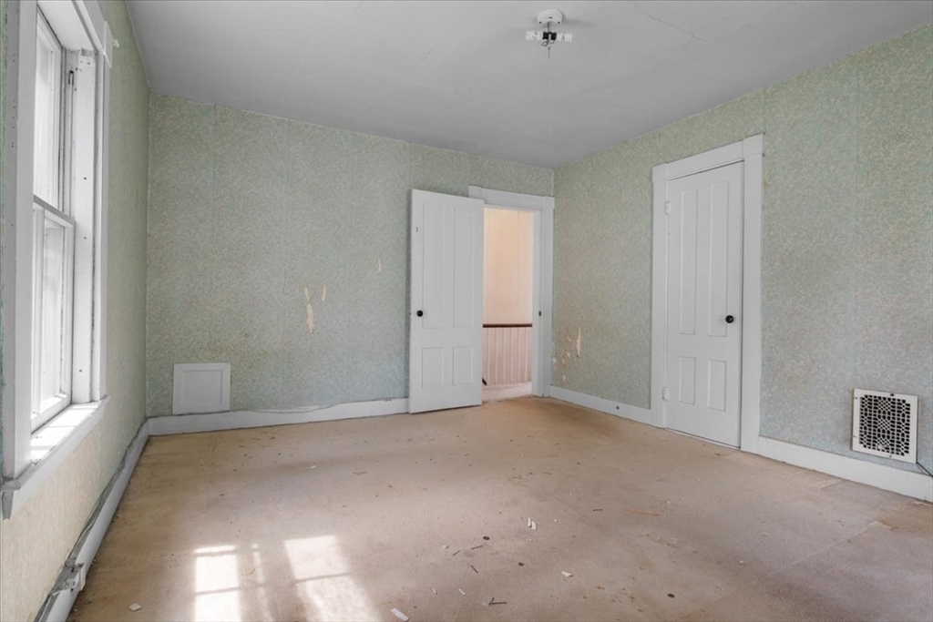 50 Clark Street Dedham, MA 02026 - Photo 24 of 38 a view of an empty room with a window