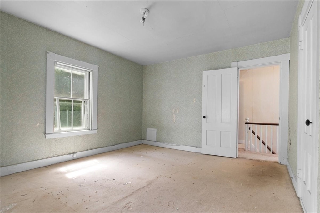 50 Clark Street Dedham, MA 02026 - Photo 25 of 38 an empty room with windows and closet