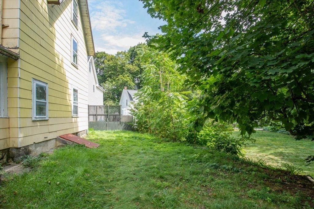 50 Clark Street Dedham, MA 02026 - Photo 30 of 38 a view of a back yard of the house