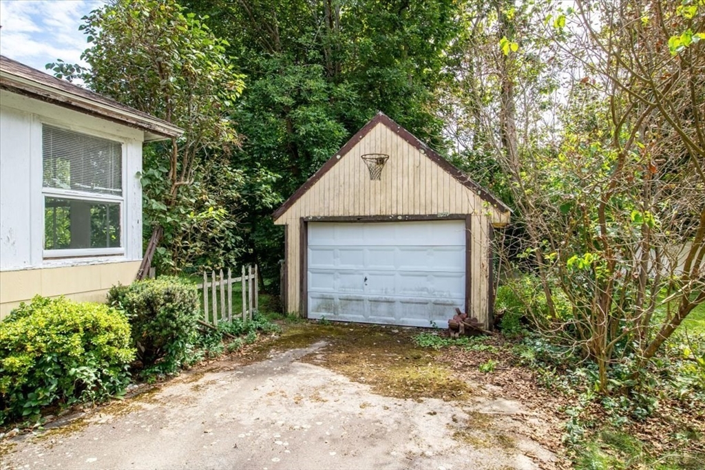 50 Clark Street Dedham, MA 02026 - Photo 33 of 38 a view of a house with a yard and garage