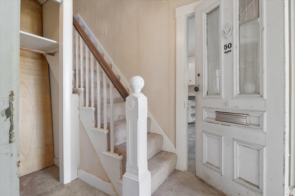 50 Clark Street Dedham, MA 02026 - Photo 9 of 38 a view of entryway and hall with wooden floor
