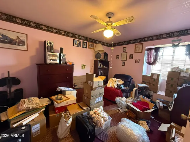 a living room with lots of furniture and a chandelier