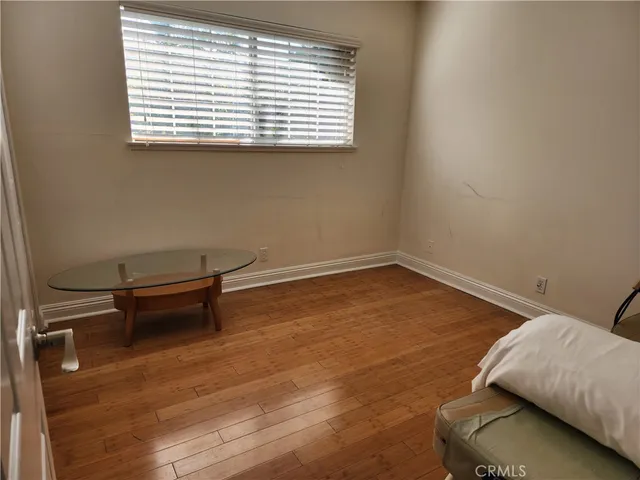 a room with a bed and a window