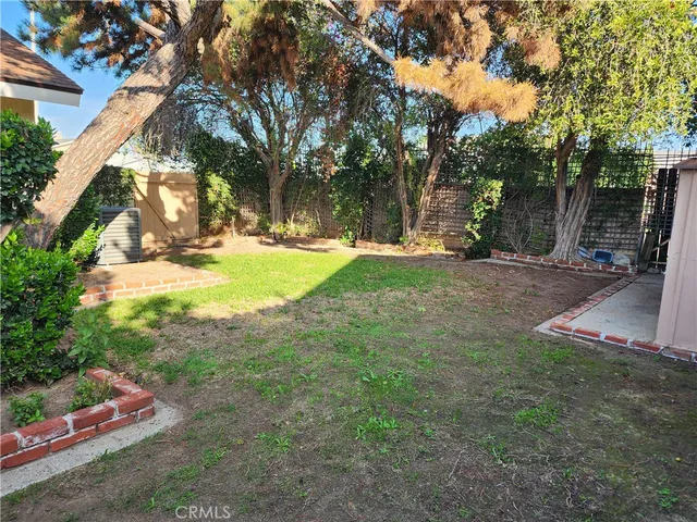 a view of a tree in front of a house