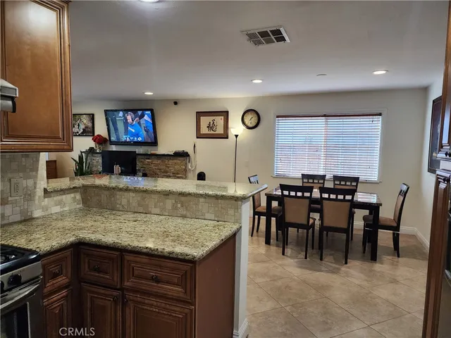 a view of kitchen island with granite countertop furniture and a counter top space