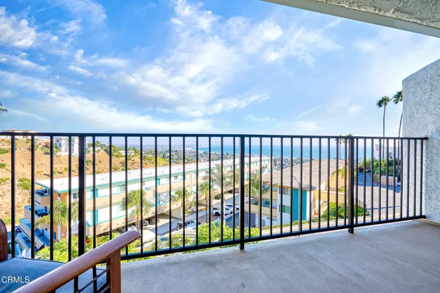 a view of a black and white sky from a balcony