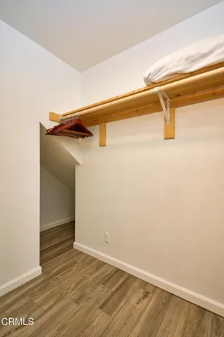 a view of a patio with table and chairs potted plants