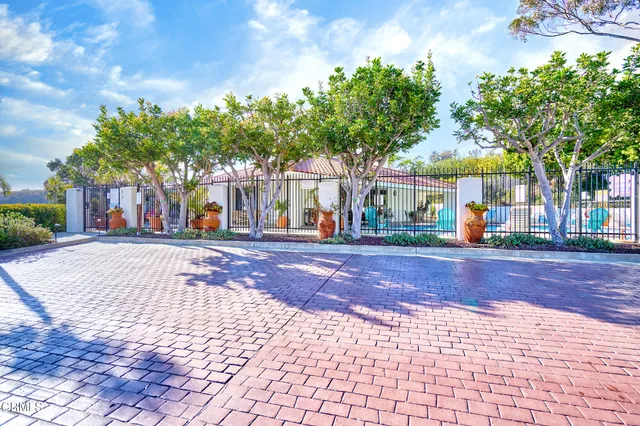 a view of a backyard with furniture and a table