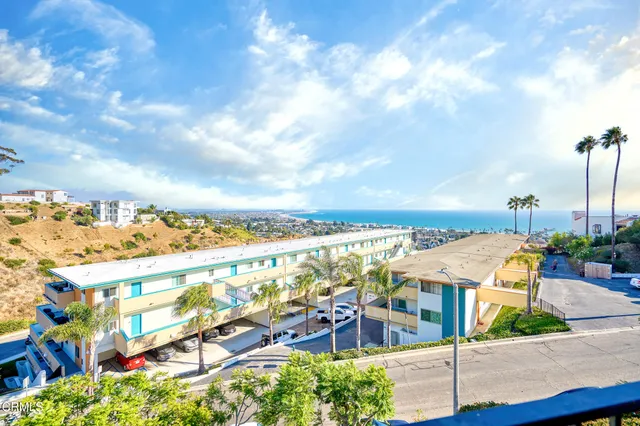 a view of a house with a yard and garage