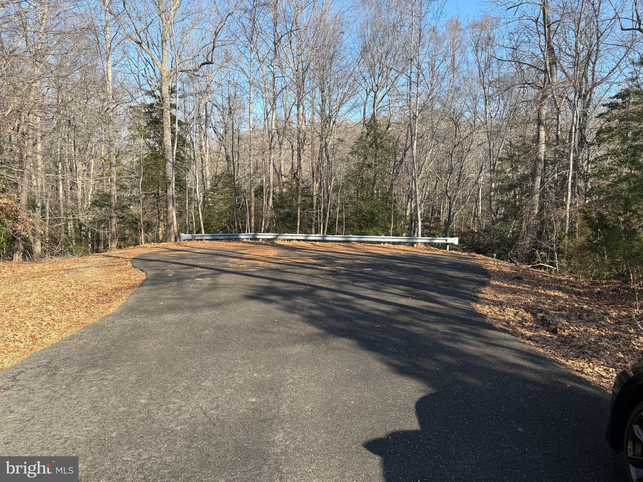 8272 Overlook Road Lusby, MD 20657 - Photo 2 of 6 a view of outdoor space with deck and trees