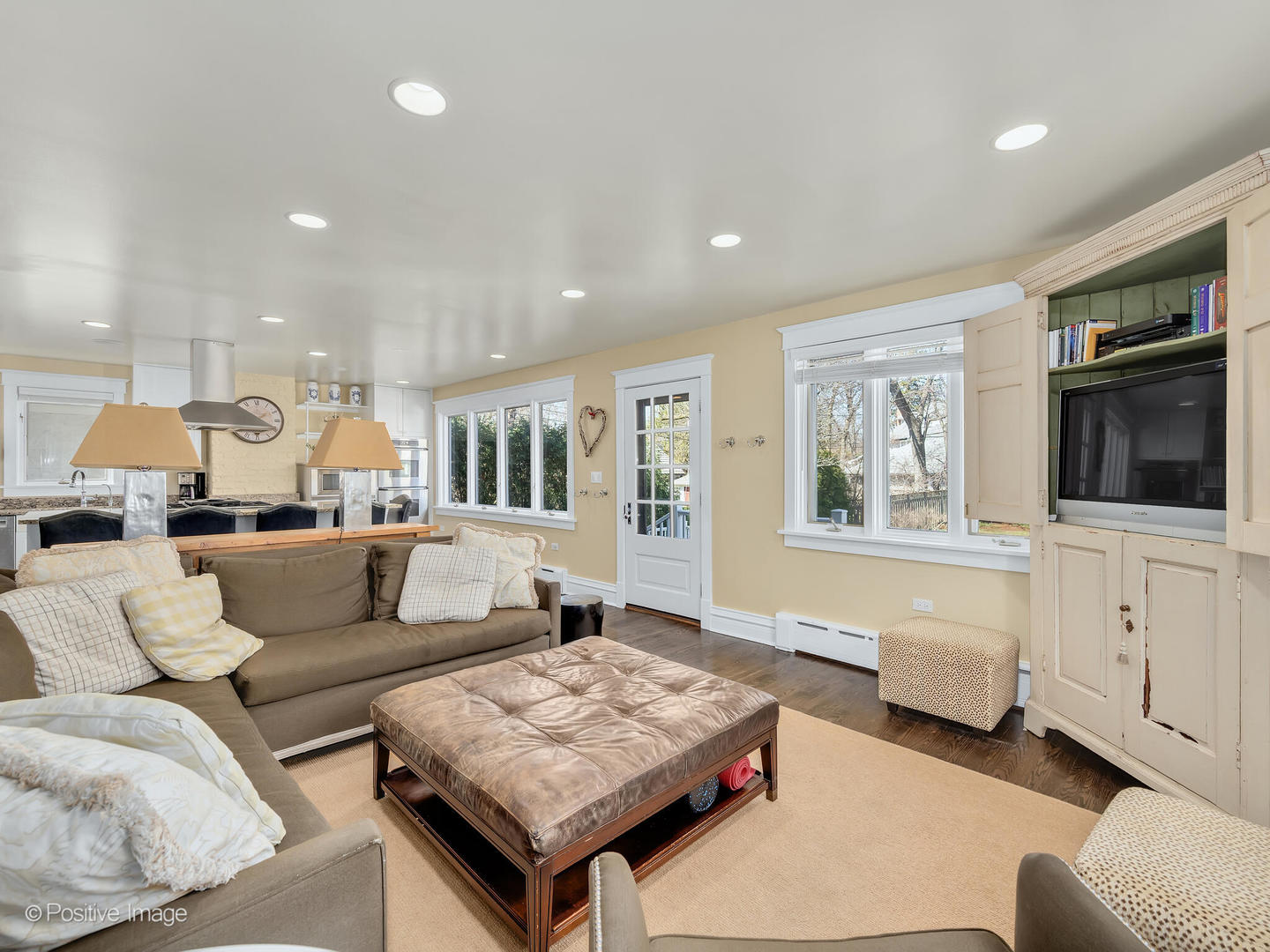 607 Willow Road Winnetka, IL 60093 - Photo 12 of 51 a living room with furniture and a flat screen tv