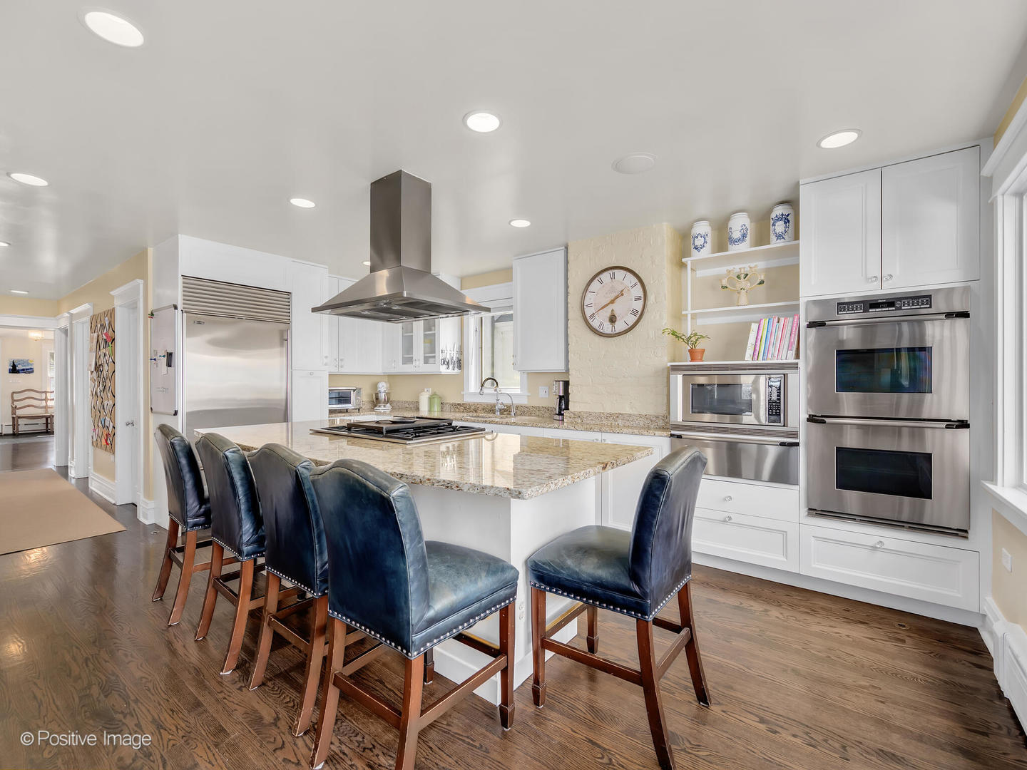 607 Willow Road Winnetka, IL 60093 - Photo 14 of 51 a large kitchen with a table and chairs