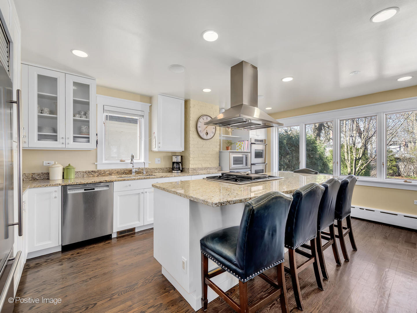 607 Willow Road Winnetka, IL 60093 - Photo 16 of 51 a kitchen with stainless steel appliances granite countertop wooden floor and large window