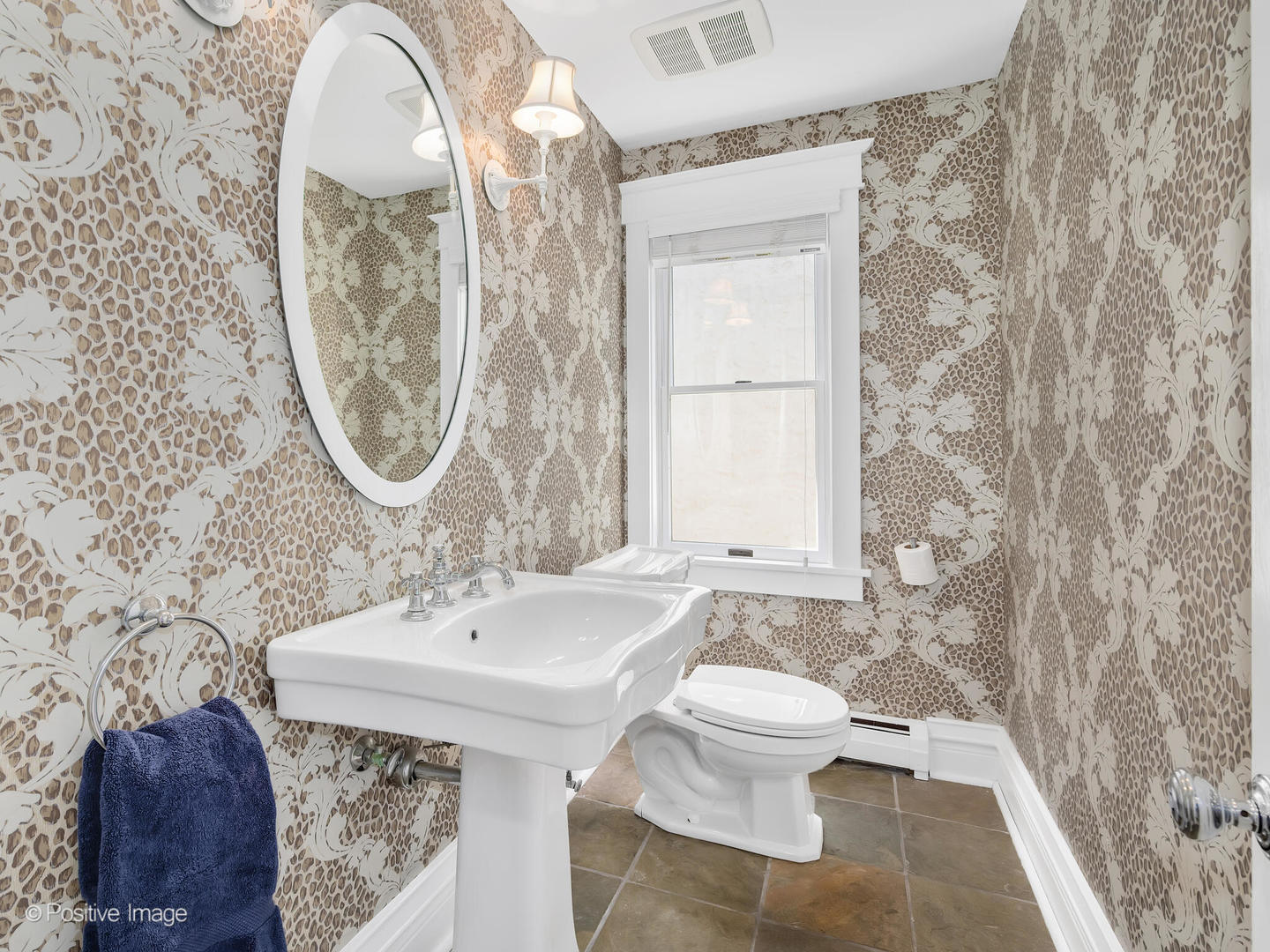 607 Willow Road Winnetka, IL 60093 - Photo 17 of 51 a bathroom with a sink a toilet and a mirror