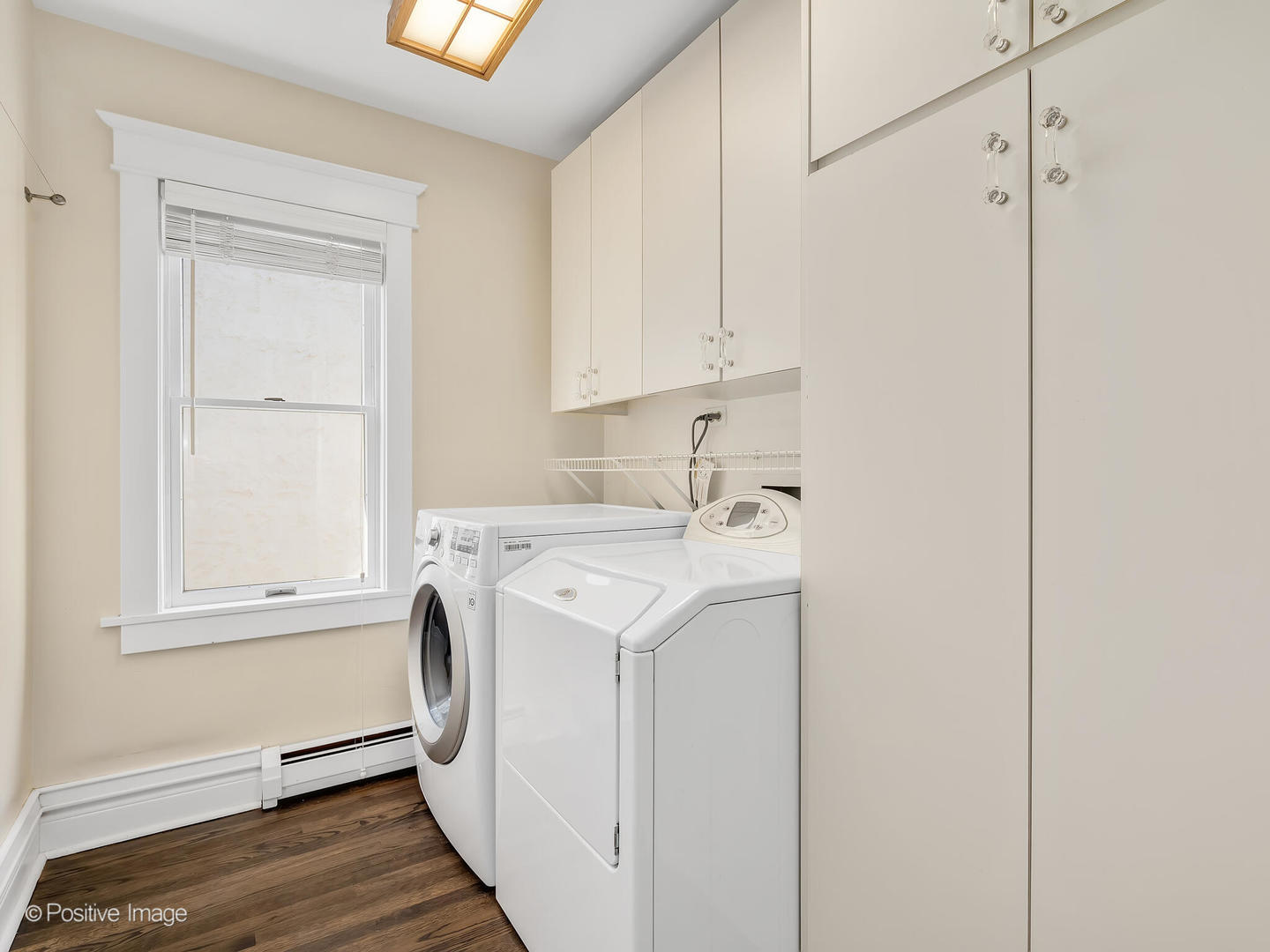607 Willow Road Winnetka, IL 60093 - Photo 18 of 51 a utility room with dryer and washer