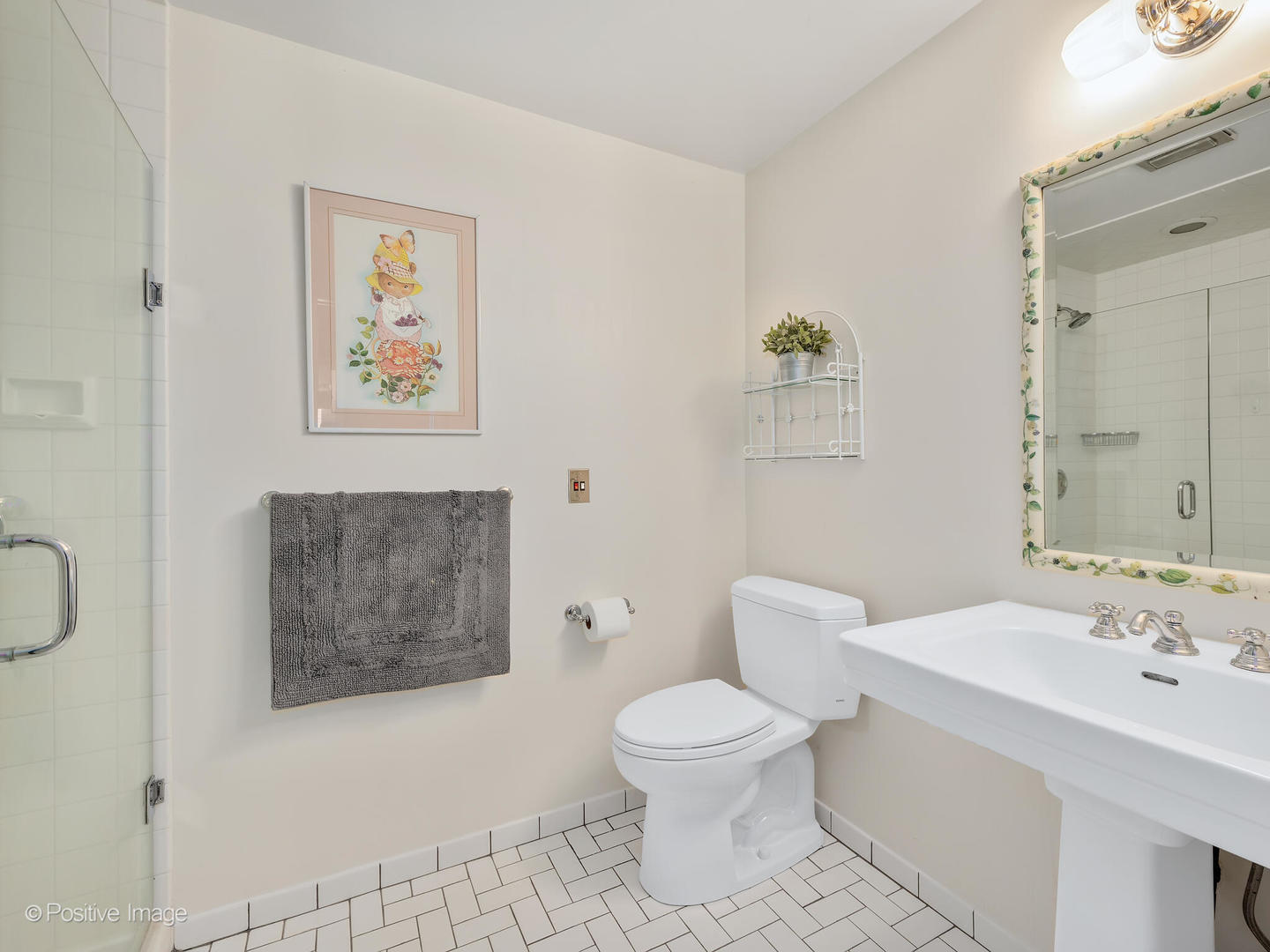 607 Willow Road Winnetka, IL 60093 - Photo 27 of 51 a bathroom with a toilet sink and mirror