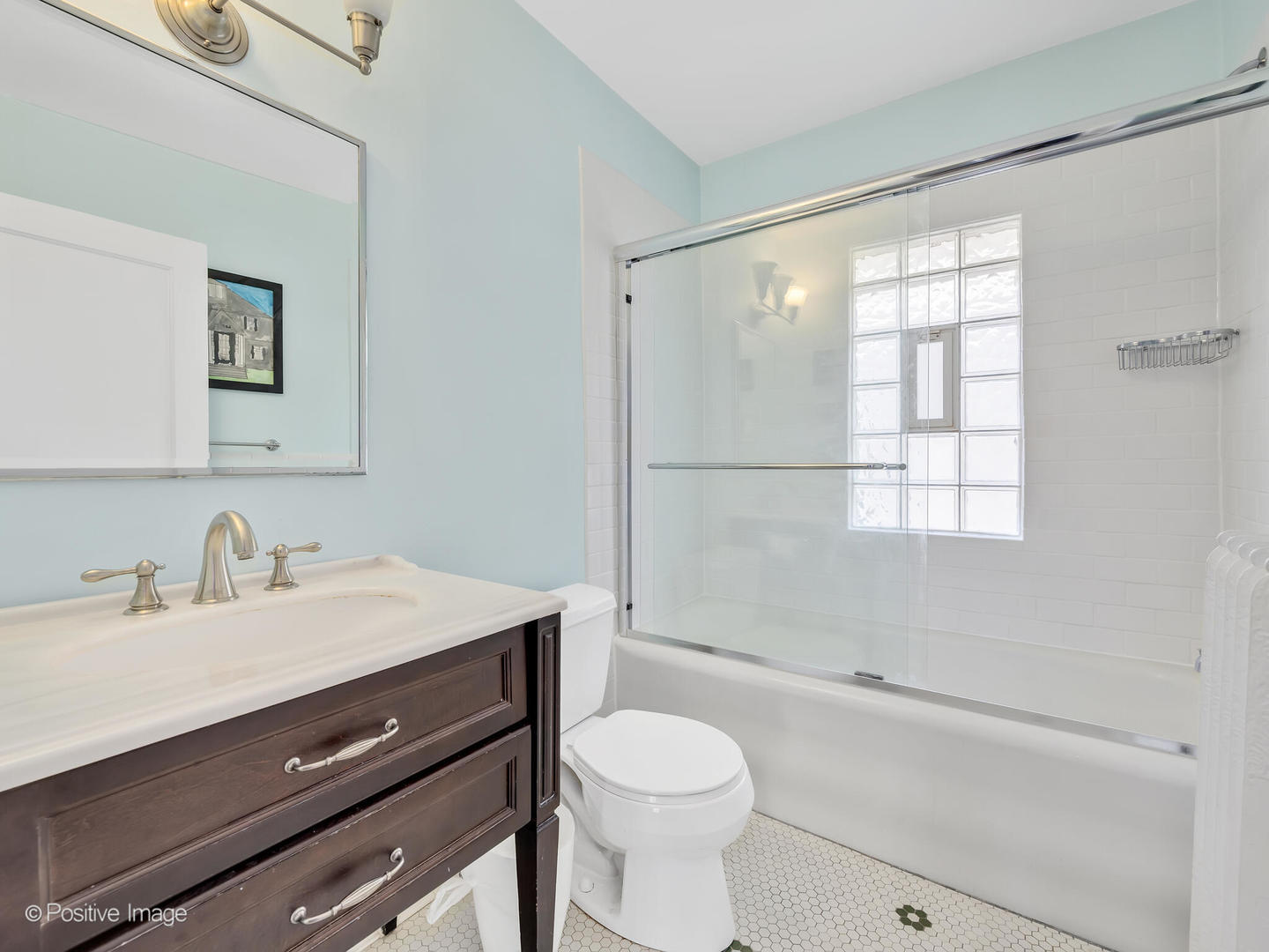 607 Willow Road Winnetka, IL 60093 - Photo 29 of 51 a bathroom with a sink toilet vanity and shower