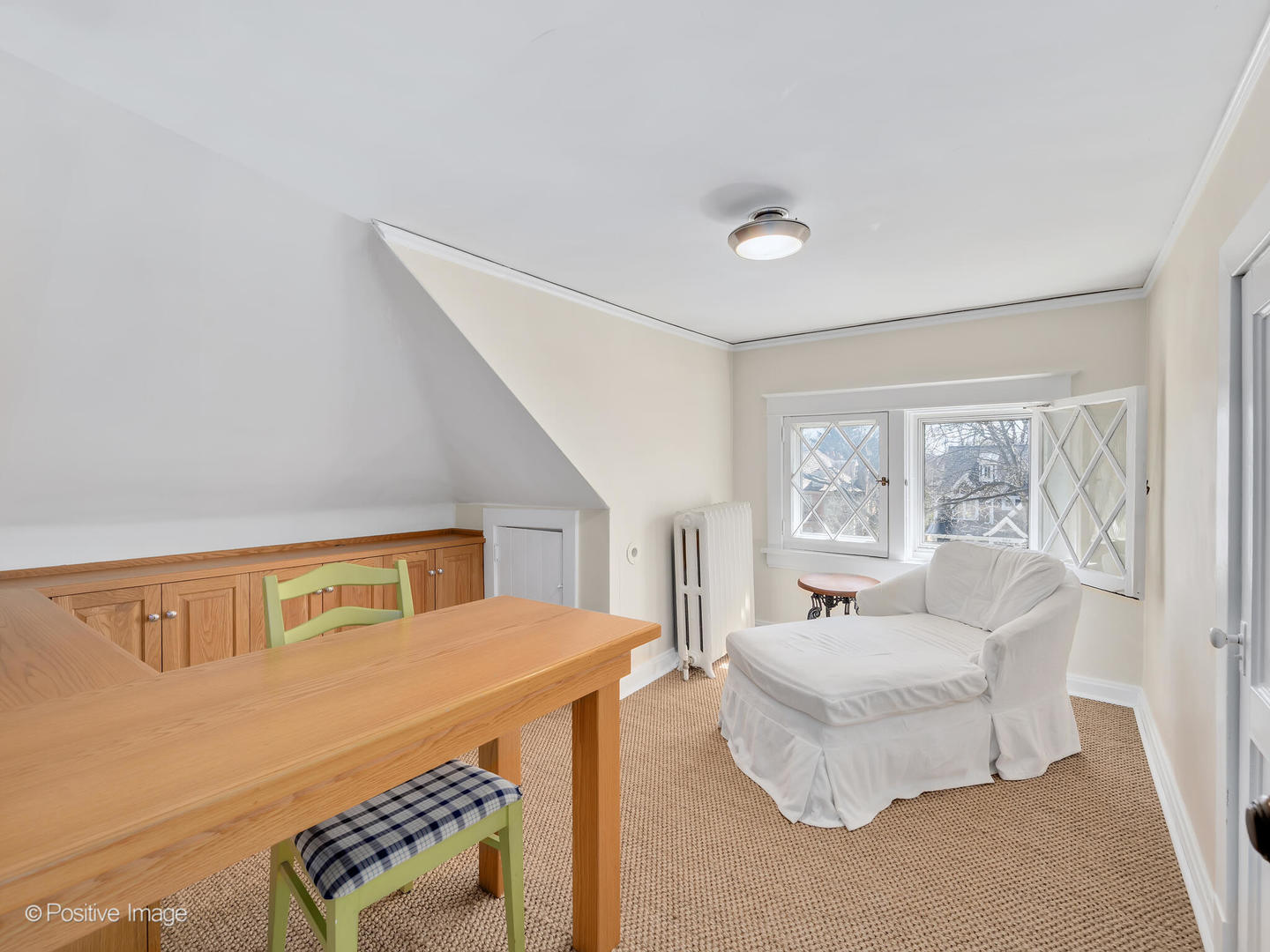607 Willow Road Winnetka, IL 60093 - Photo 30 of 51 a bedroom with furniture and a large window
