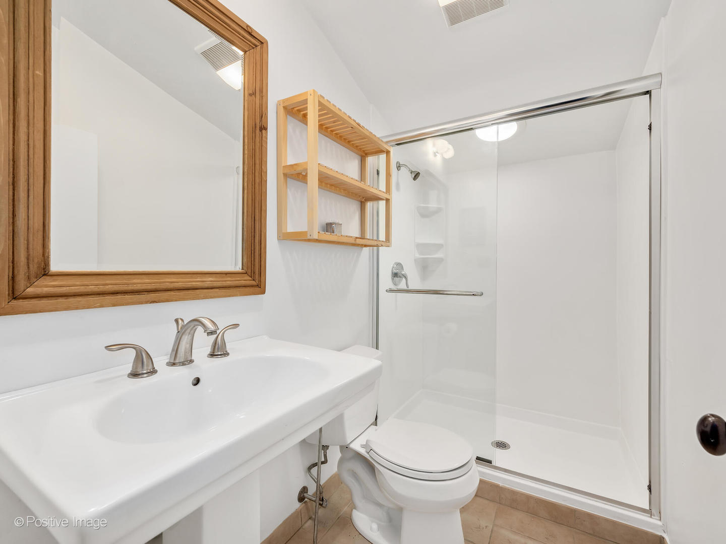 607 Willow Road Winnetka, IL 60093 - Photo 34 of 51 a bathroom with a sink and a mirror