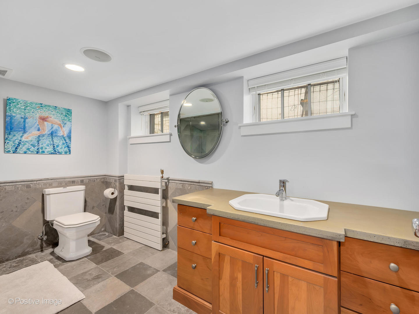 607 Willow Road Winnetka, IL 60093 - Photo 43 of 51 a bathroom with a sink and a mirror