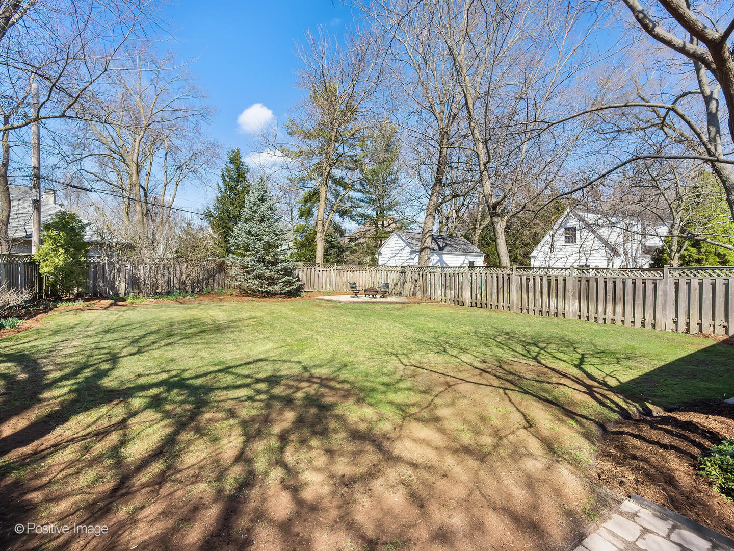 607 Willow Road Winnetka, IL 60093 - Photo 48 of 51 a view of a garden with a bench