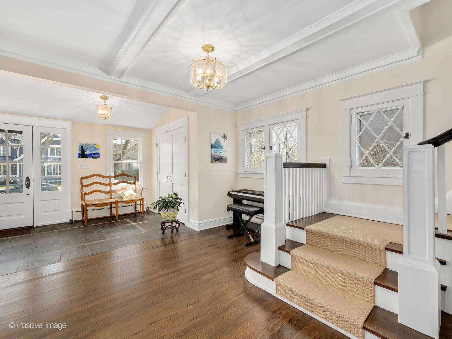 607 Willow Road Winnetka, IL 60093 - Photo 5 of 51 a living room with furniture and a chandelier