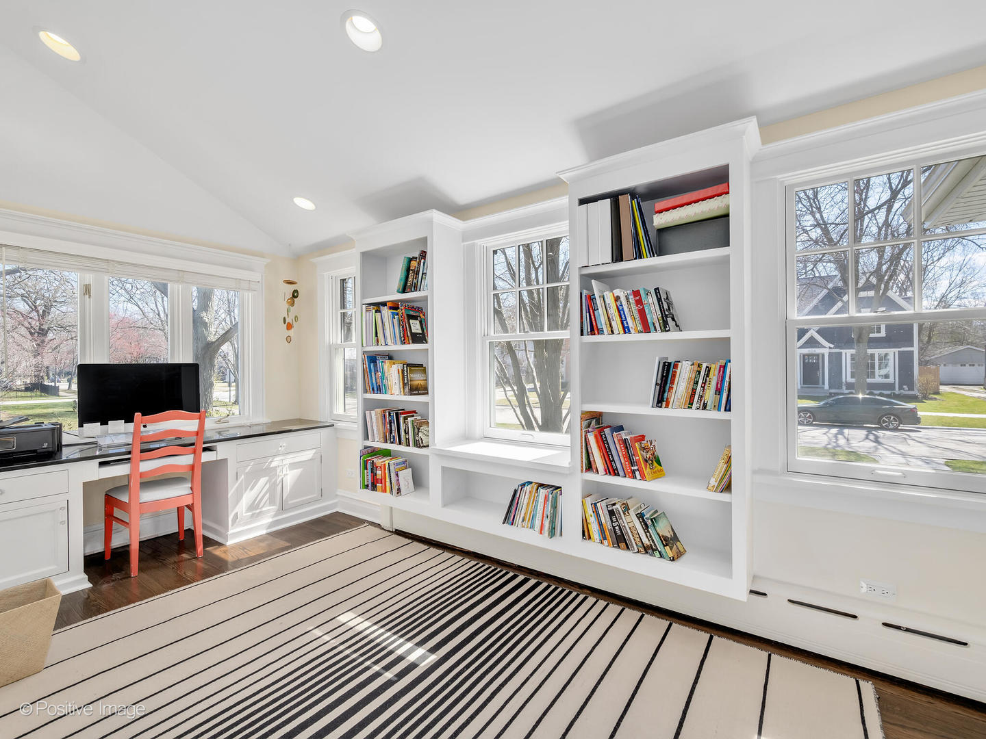 607 Willow Road Winnetka, IL 60093 - Photo 7 of 51 a living room with furniture and a book shelf