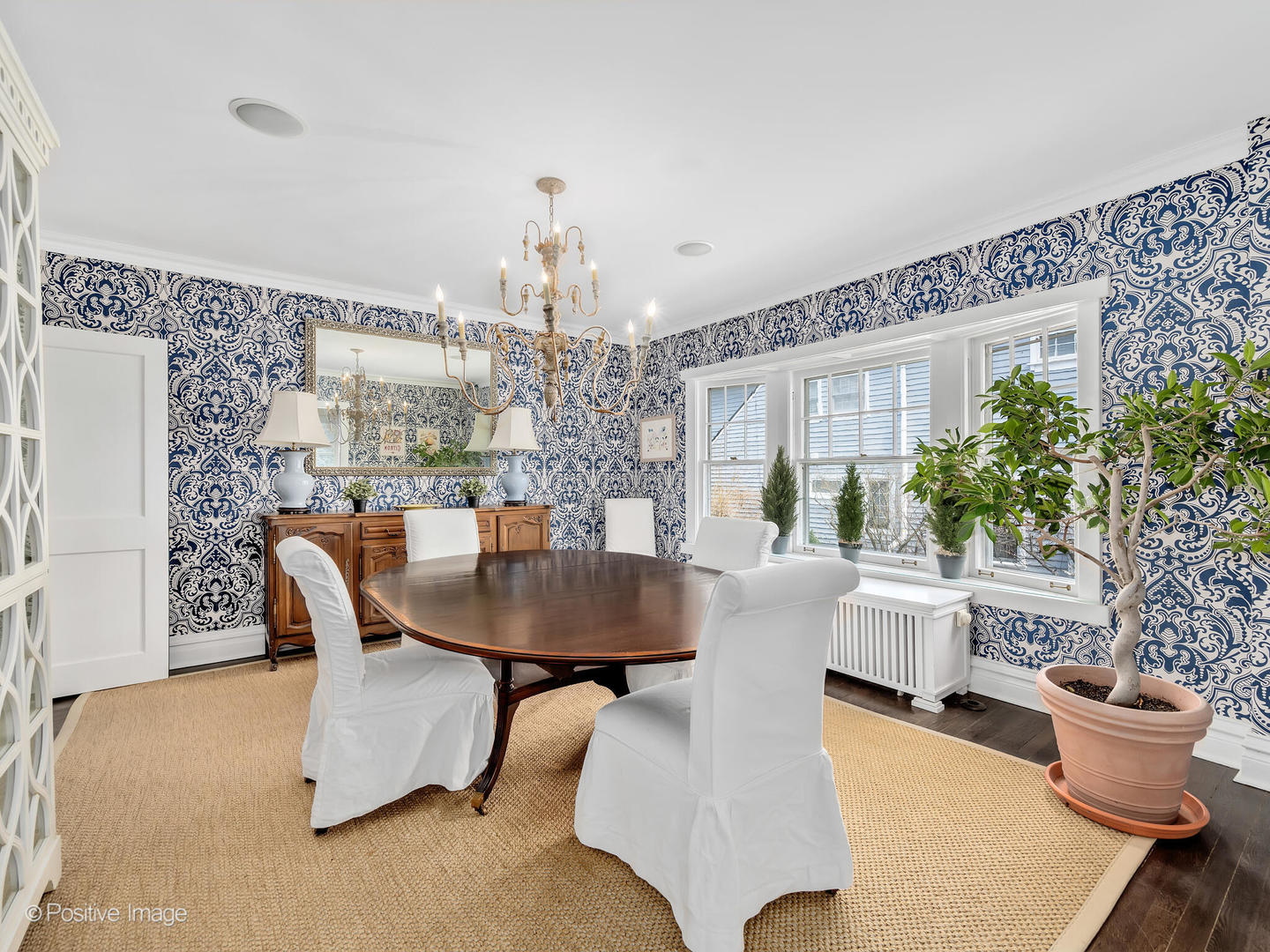 607 Willow Road Winnetka, IL 60093 - Photo 8 of 51 a living room with furniture and a chandelier